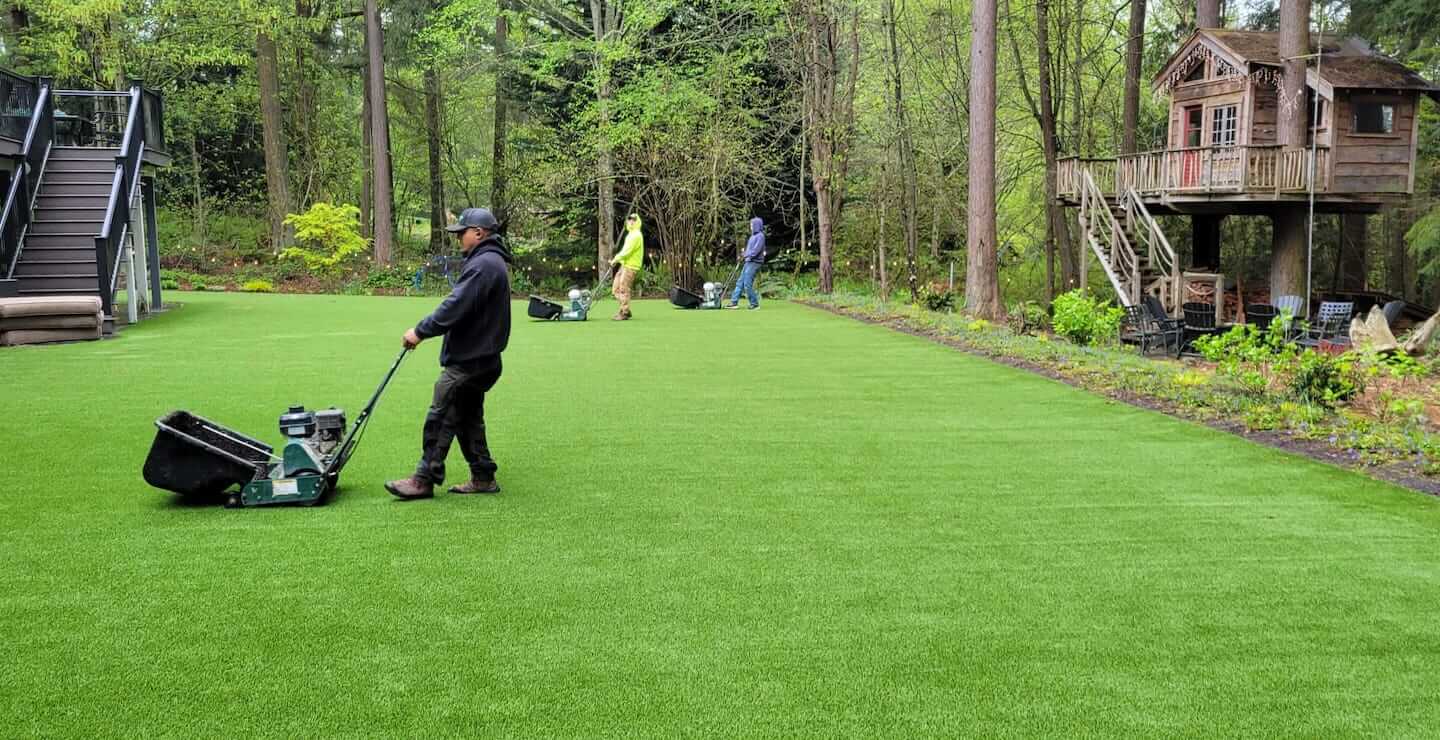 Turf installation crew preparing a Fort Worth project